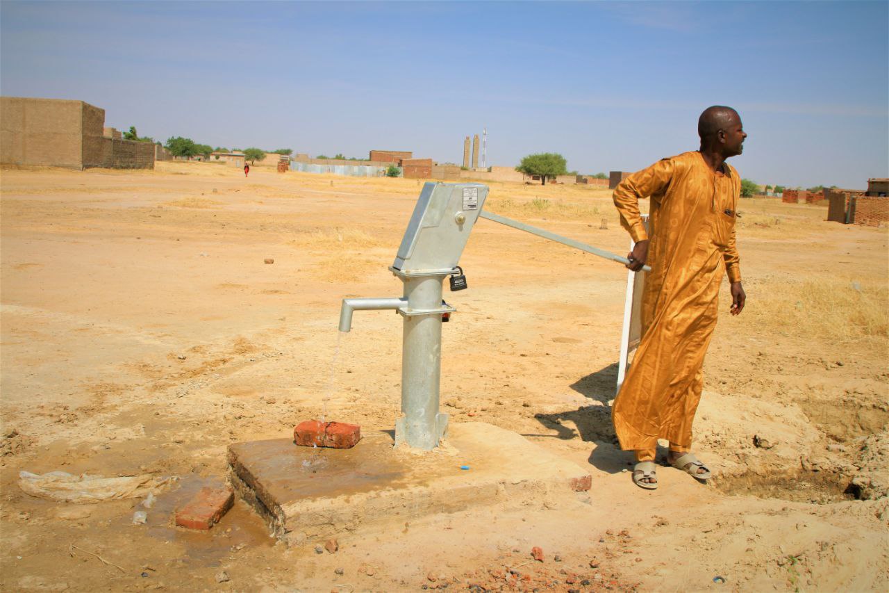 A man at a completed well in Abourdja